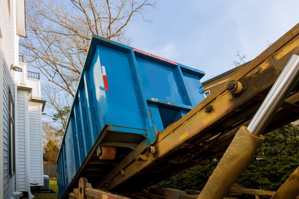 Unloading empty dumpster